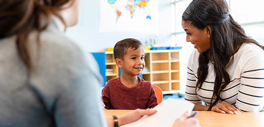 student working with two adults